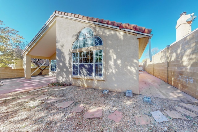 back of house with a patio area