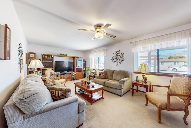 living room with carpet and ceiling fan