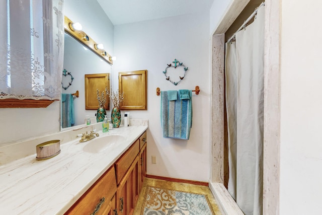 bathroom featuring tile patterned floors and vanity