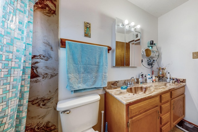 bathroom with vanity and toilet