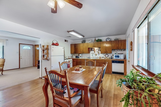 dining space featuring ceiling fan, plenty of natural light, and light hardwood / wood-style flooring