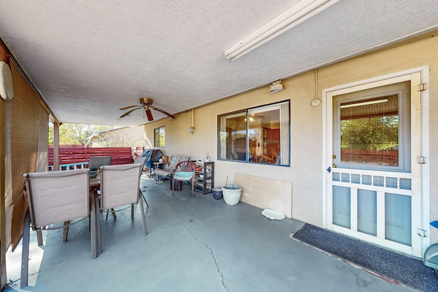 view of patio featuring ceiling fan