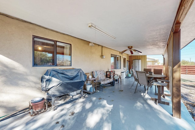 view of patio / terrace with ceiling fan and a grill