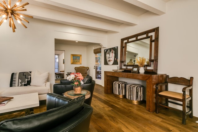 living room with a chandelier, dark wood-type flooring, and beamed ceiling