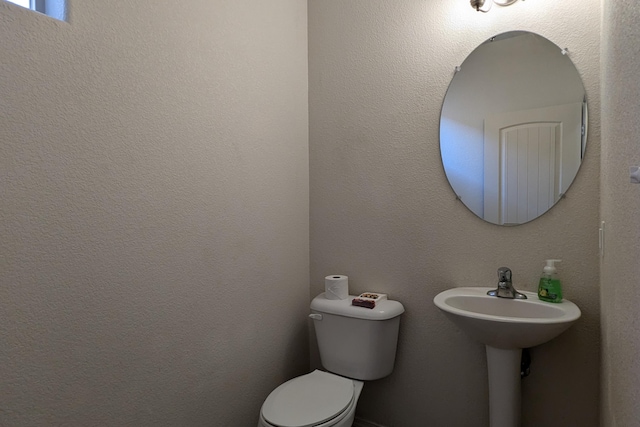 bathroom featuring toilet