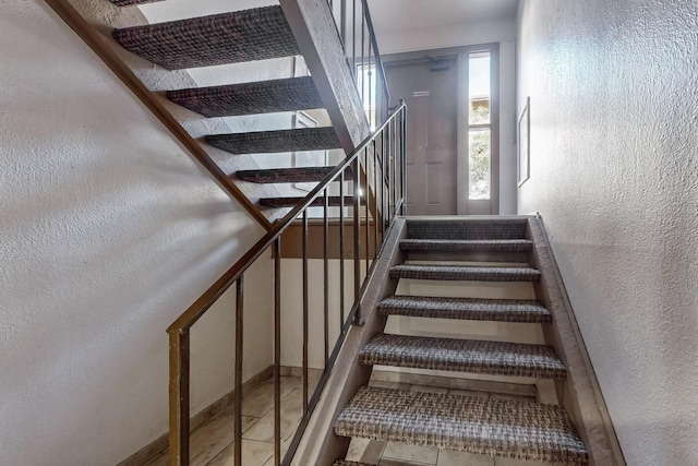 staircase with tile patterned flooring