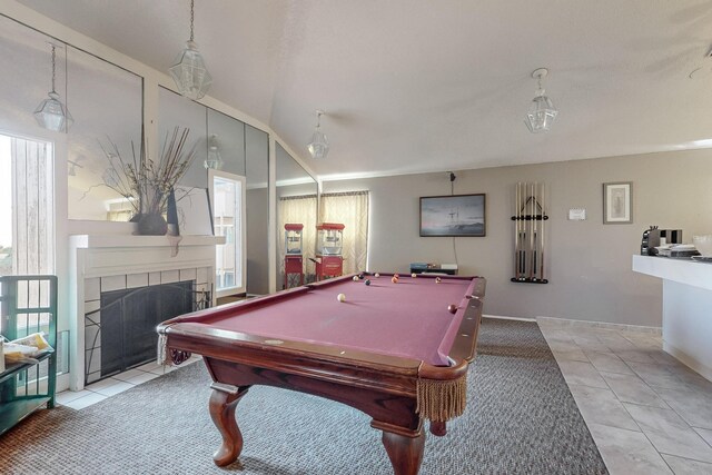 rec room featuring a tiled fireplace, billiards, light tile patterned floors, and lofted ceiling