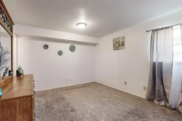 interior space featuring a textured ceiling