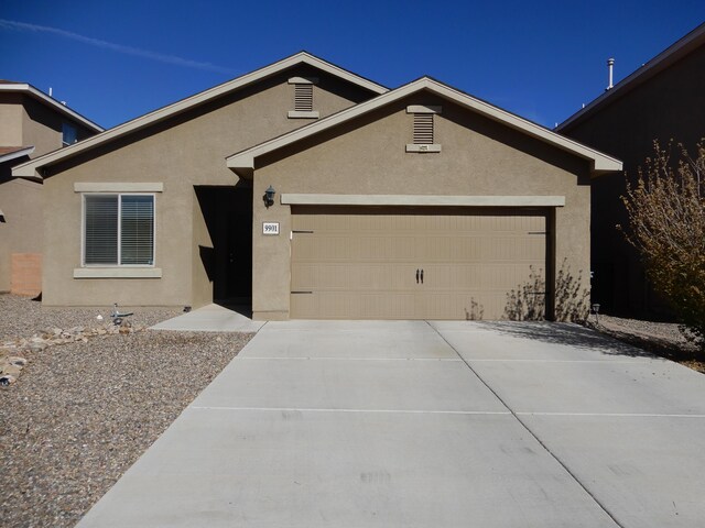 ranch-style home with a garage