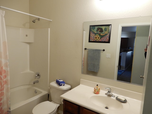 full bathroom featuring vanity, shower / tub combo, and toilet