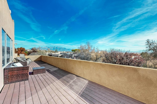 wooden deck with a mountain view