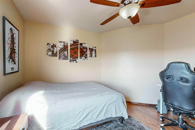 bedroom featuring hardwood / wood-style flooring and ceiling fan