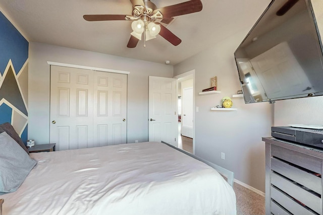 bedroom with carpet flooring, ceiling fan, and a closet