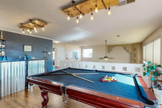 recreation room with ceiling fan, billiards, ornamental molding, and hardwood / wood-style flooring