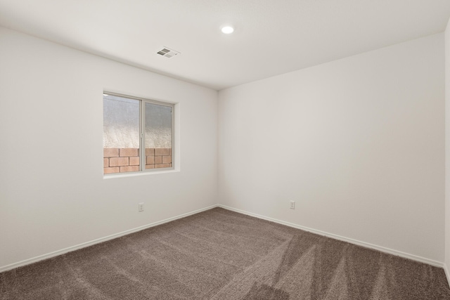 spare room with carpet floors