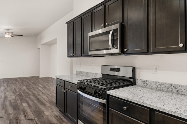 kitchen with hardwood / wood-style floors, dark brown cabinets, and stainless steel appliances