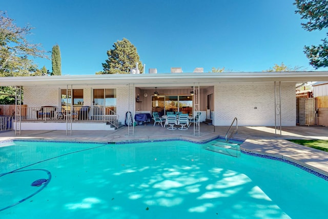 view of pool featuring ceiling fan and a patio area