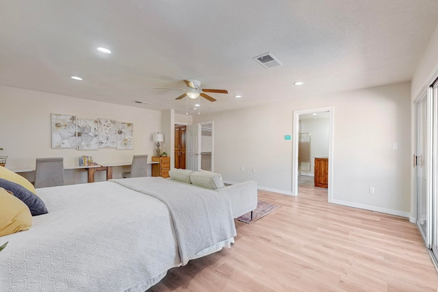 bedroom with light hardwood / wood-style floors and ceiling fan