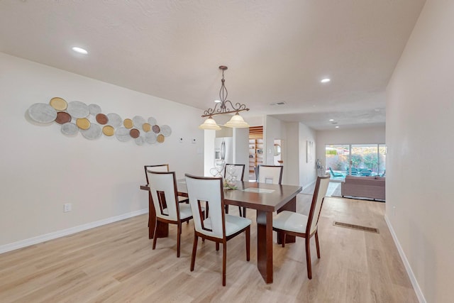 dining area with light hardwood / wood-style flooring