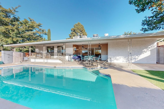 view of swimming pool featuring a patio area