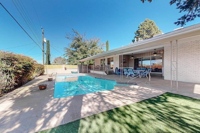 view of pool with ceiling fan and a patio area