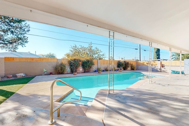 view of pool featuring a patio