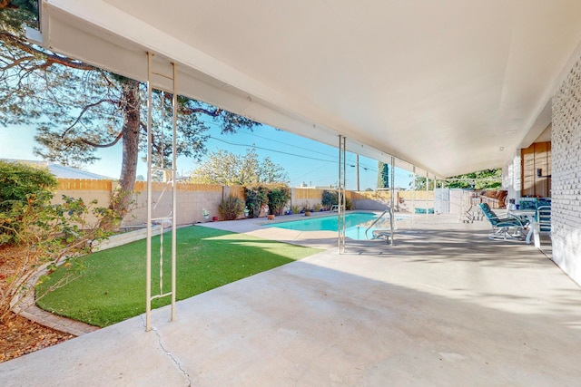 view of patio with a fenced in pool