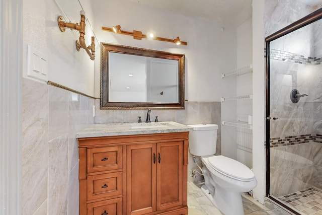 bathroom featuring vanity, an enclosed shower, tile walls, and toilet