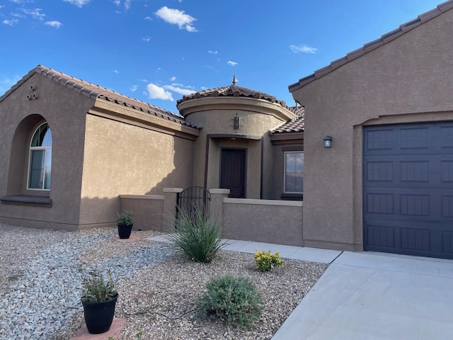 property entrance with a garage