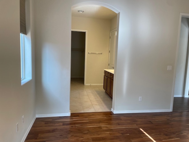 hallway featuring dark hardwood / wood-style floors