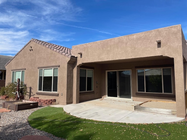 rear view of house featuring a patio area