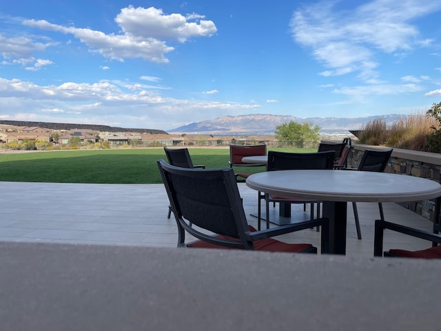 view of patio featuring a deck with mountain view