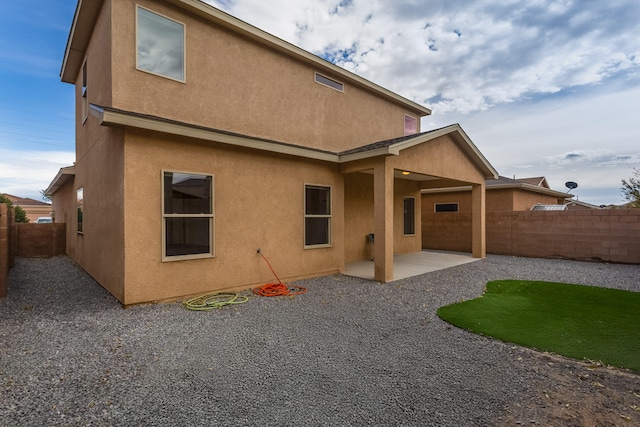 back of house featuring a patio