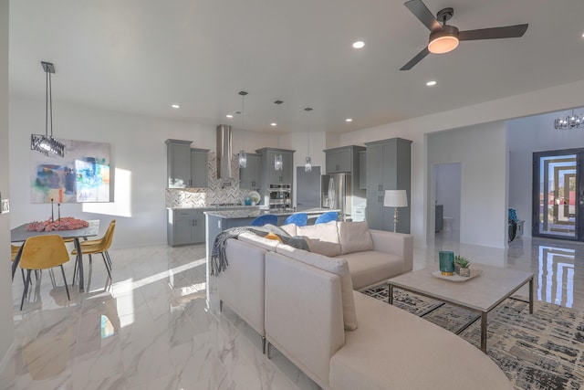 1109 11th St SE, Rio Rancho, NM 87124 - living room with marble finish floor, ceiling fan with notable chandelier, and recessed lighting