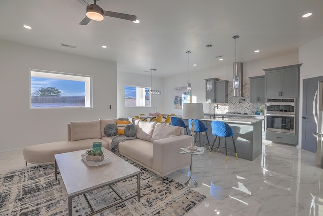 1109 11th St SE, Rio Rancho, NM 87124 - living area featuring marble finish floor, ceiling fan, and recessed lighting