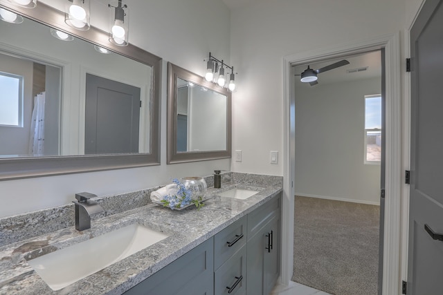 bathroom featuring vanity, a wealth of natural light, and ceiling fan