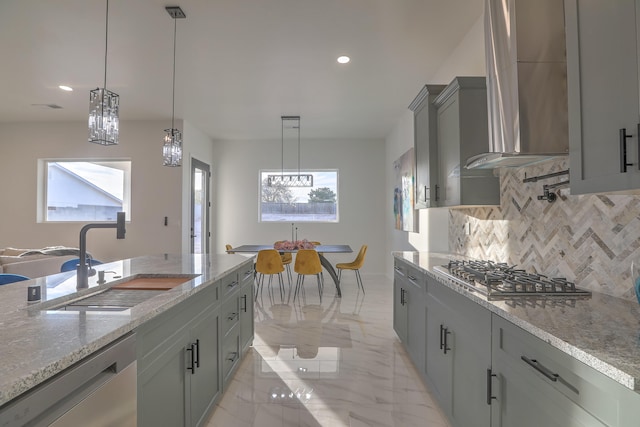 kitchen with dishwasher, decorative light fixtures, sink, and stainless steel gas cooktop