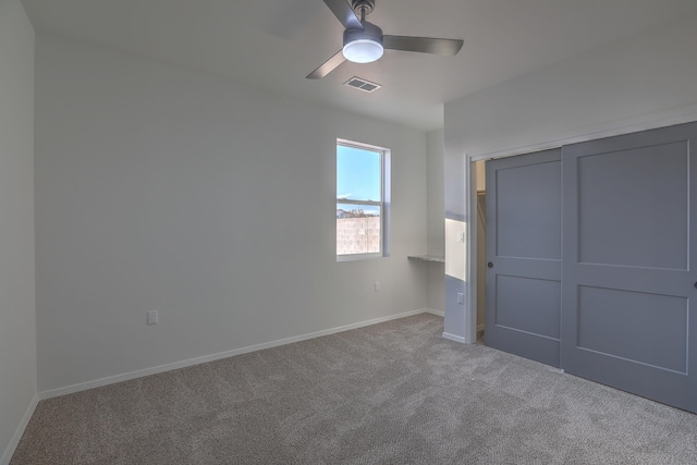 1109 11th St SE, Rio Rancho, NM 87124 - unfurnished bedroom with baseboards, carpet flooring, visible vents, and a ceiling fan