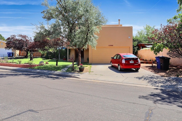 view of front facade featuring a front lawn and a garage