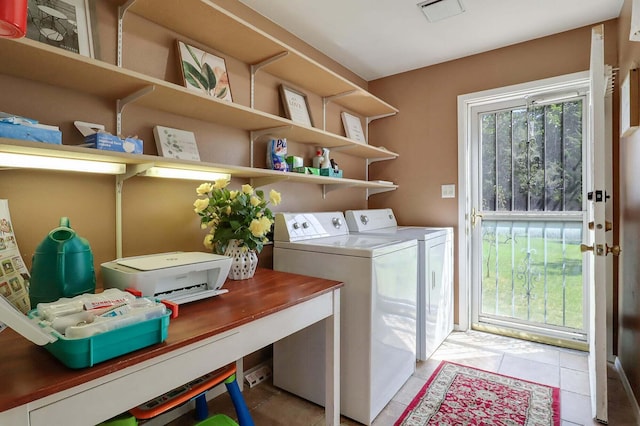 washroom featuring light tile patterned floors and washing machine and clothes dryer