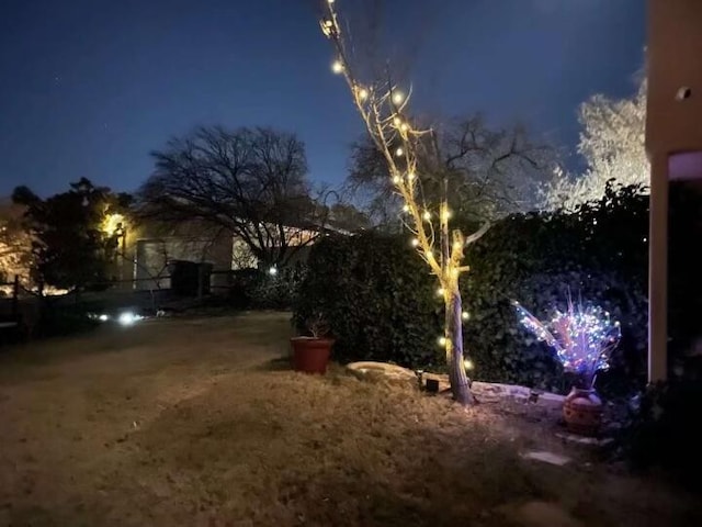 view of yard at twilight