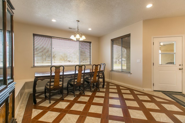 170 Esperanza Dr, Bosque Farms, NM 87068 - dining space featuring baseboards, a textured ceiling, recessed lighting, and a notable chandelier