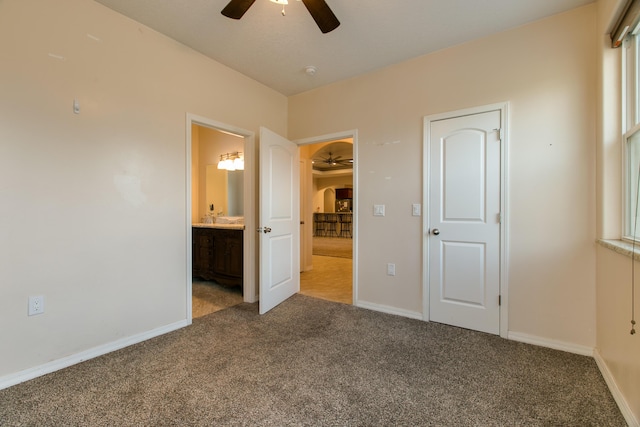 170 Esperanza Dr, Bosque Farms, NM 87068 - unfurnished bedroom featuring carpet, baseboards, and connected bathroom
