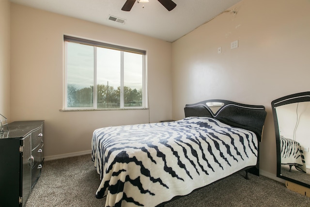 bedroom featuring dark carpet and ceiling fan