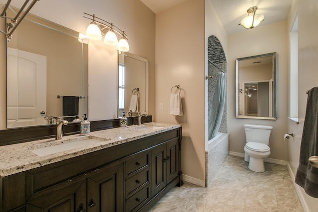 full bathroom featuring vanity, shower / bath combination with curtain, and toilet