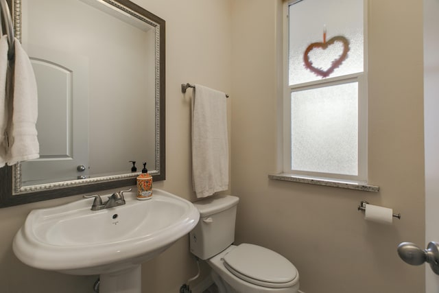 bathroom with sink and toilet