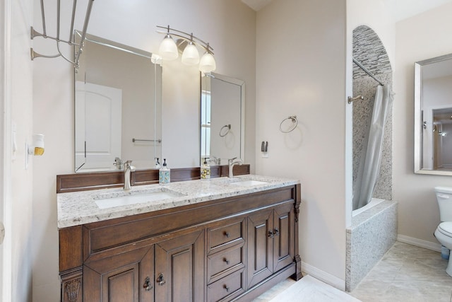 full bathroom with vanity, shower / bath combo, tile patterned floors, and toilet