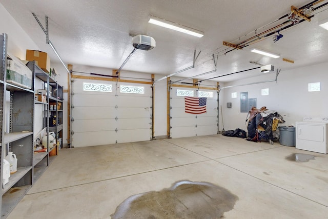 garage with washer / clothes dryer, a garage door opener, and electric panel