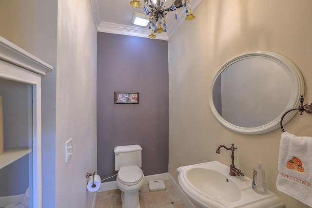 bathroom with sink, crown molding, tile patterned flooring, toilet, and a chandelier