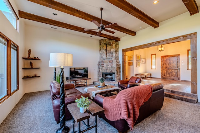 carpeted living room with a fireplace, ceiling fan, and beamed ceiling